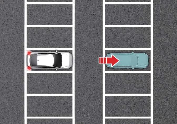Kia K4 navigating through a parking lot