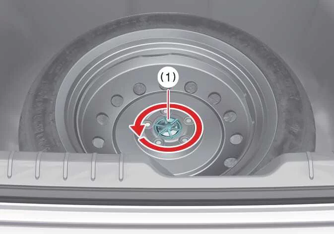 Diagram showing the location of the spare tire hold-down wing bolt in the Kia K4 cargo area
