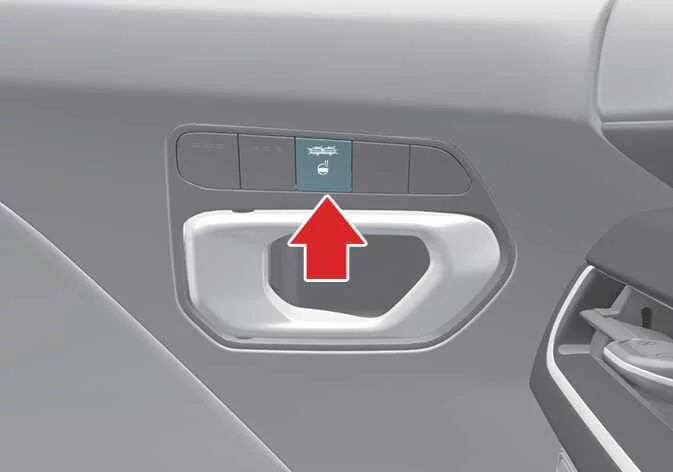 Heated steering wheel activation button in the Kia K4 interior console