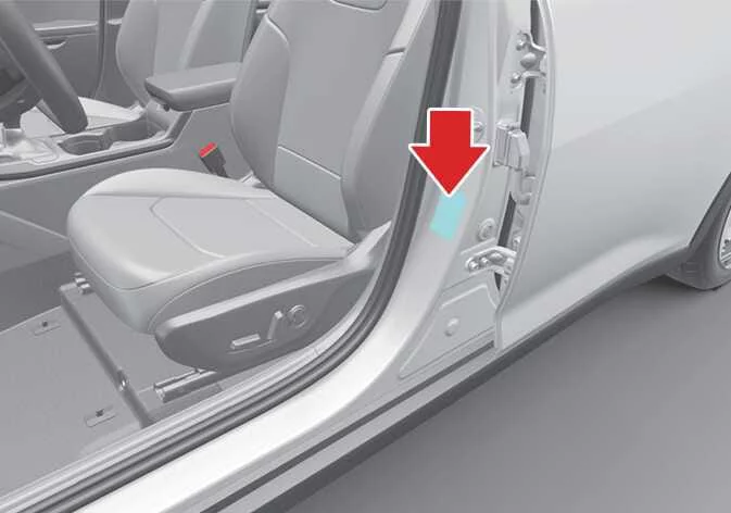 Kia K4 factory tire and loading information placard fixed to the driver side door jamb showing recommended cold tire inflation pressures and maximum cargo weight parameters