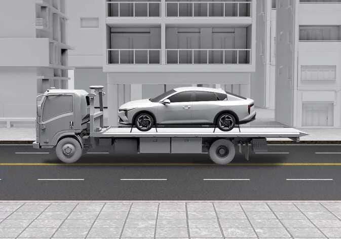 Kia K4 being prepared for professional flatbed towing service