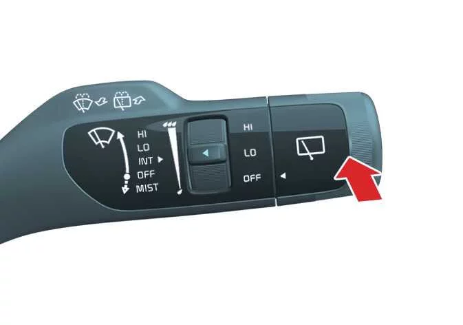 Action of pushing the Kia K4 wiper lever to activate rear washer spray